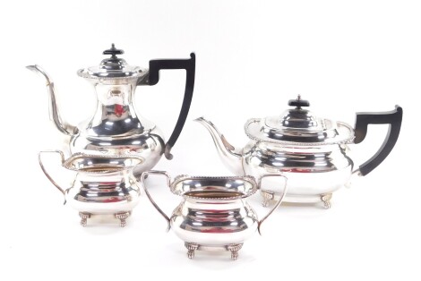 A Viners of Sheffield silver plated four piece tea and coffee set, of baluster form, raised on paw feet, comprising teapot, coffee pot, cream jug and sugar bowl.