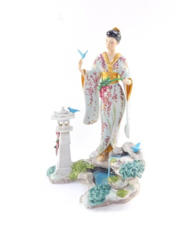 A Franklin Mint porcelain figure modelled as Mariko, Princess of The Wisteria Blooms, designed by Manabu Saito, boxed, 32cm high.