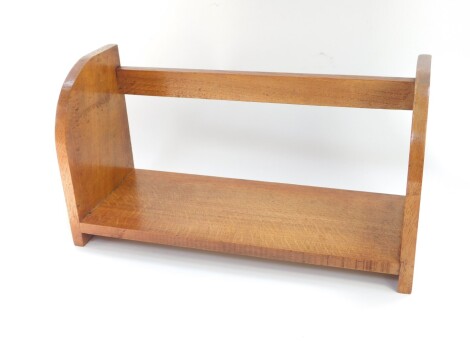 An early 20thC oak book trough, 35cm wide.