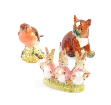 A Beswick figure of a robin, no 980., Beswick Beatrix Potter figure group modelled as Flopsy, Mopsy and Cotton Tail, later brown back stamp, and a Goebls figure of a boxer dog, CH569A. (3)