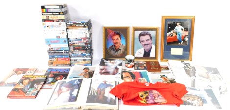 Tom Selleck. A collection of memorabilia, to include DVDs, videos, a wall clock, signed photographs, posters, fan club material, etc. (a quantity)