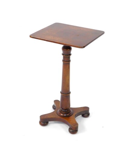 A 19thC stack top occasional table, the rounded top raised on a cylindrical stem, terminating on an inverted platform base, with compressed bun feet, 72cm high, 42cm wide, 38cm deep.