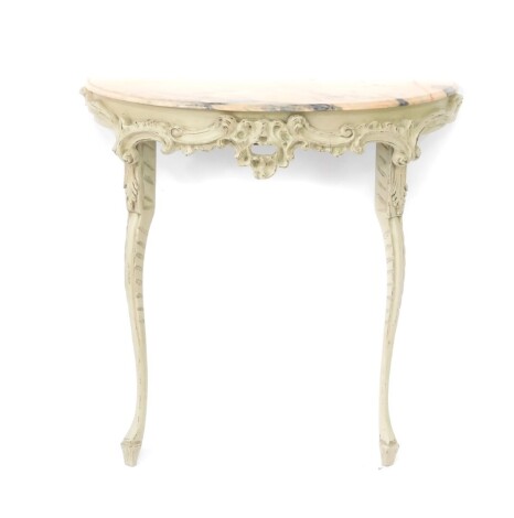 A 20thC French style console table, the D end marble finish top raised above a heavily carved frame, raised with scrolls and flower heads, on cabriole legs with acanthus leaf mouldings, terminating in spade feet, 93cm high, 83cm wide, 37cm deep.