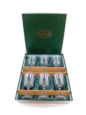 A set of six Royal Doulton cut glass wine glasses, boxed.