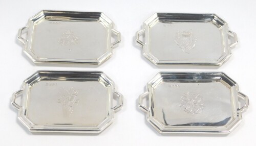 Four silver miniature trays, of twin handled octagonal form, engraved with the Flowers of the Four Nations, Sheffield 1977, 6.3oz.