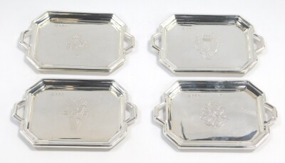 Four silver miniature trays, of twin handled octagonal form, engraved with the Flowers of the Four Nations, Sheffield 1977, 6.3oz.