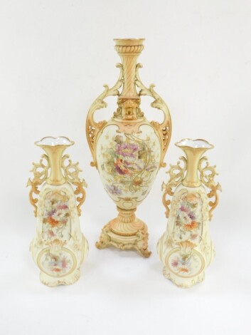 A Continental late 19thC blush porcelain vase, of twin handled baluster form, painted with reserves of flowers, 48cm high., together with a similar pair of vases, 30cm high. (3)