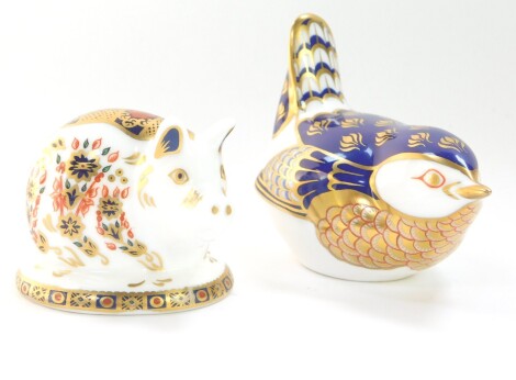 A Royal Crown Derby paperweight ornament pig, silver stopper, printed marks beneath, 5cm high another of a Chaffinch, lacking stopper, both boxed (2).