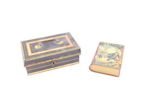 An early 20thC tin plate Treasure Island book money box, the case is in colours with key, 16cm high, and a further cash tin with sectional interior. (2)