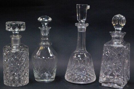 Four various 20thC crystal and other decanters, to include a mallet shaped example with shaped stopper and repeat hobnail cut geometric pattern to the body, 33cm high, another of shouldered circular form. (4)