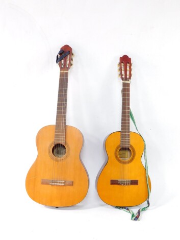 A Dulcet Classic Rose-Morris acoustic guitar, stock no 3057, with shaped case, articulated tuning knops and six strings, with interior label, 106cm high, and an Angelica guitar, model 2850, 93cm high (2)