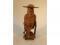 A Chinese carved hardwood figure of a sage wearing a hat