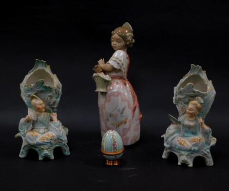 A Nao porcelain figure of a girl, modelled in traditional Spanish dress, with a basket of roses, (AF), together with an enamel egg on stand, and a pair of Continental bisque porcelain vases, late 19thC modelled as seated China man and woman, with nodding 