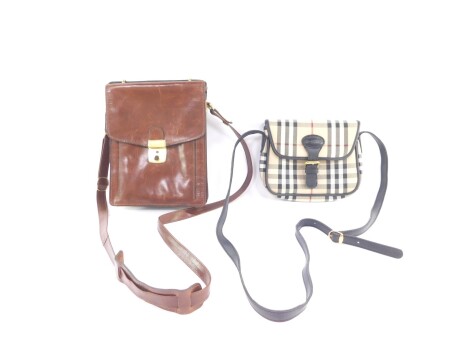 A Burberrys grey check shoulder bag, with shoulder strap, 21cm wide., together with a brown leather messenger bag, unmarked. (2)