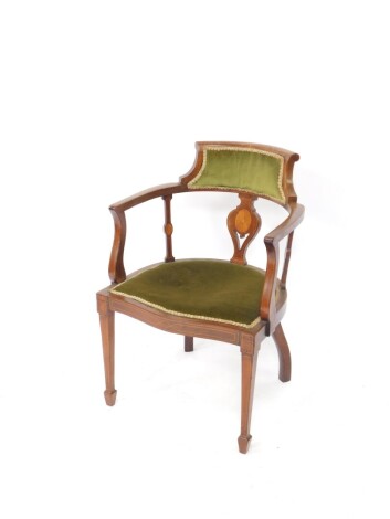 An Edwardian mahogany boxwood sprung Sheraton Revival armchair, with shaped overstuffed back, heart shaped splat set with an oval patera, shield shaped seat and square tapering front legs terminating in spade feet, 79cm high.