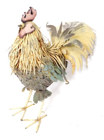 A modern Folk Art style metal ware freestanding figure of a cockerel, with shaped and decorative plumage, 89cm high.