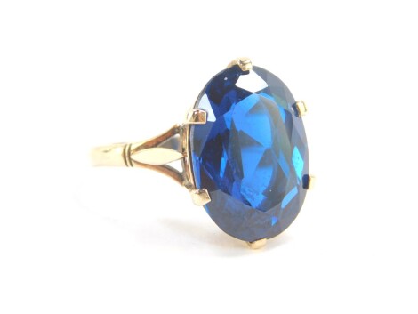 A 9ct gold and blue topaz ring, the oval cut stone approx 12cts, size R, 6.9g.