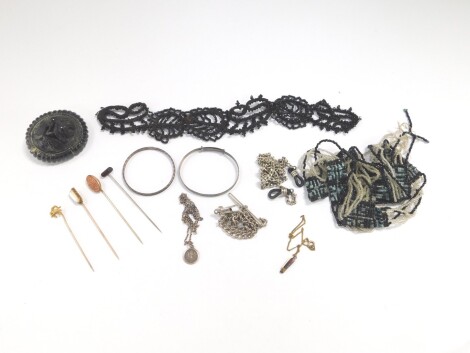 Victorian and later silver and costume jewellery, including a jet brooch, tie pins, bangles, and neck chains.