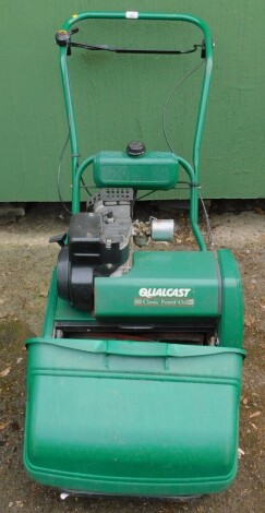 A Qualcast Classic petrol cylinder mower.