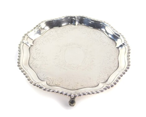 A George III silver piecrust card salver, with bright cut engraving, shield reserve, Richard Rugg I, London 1766, 6.10oz.