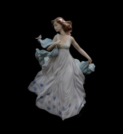 A Lladro porcelain figure modelled as Summer Serenade, No 06193, boxed.