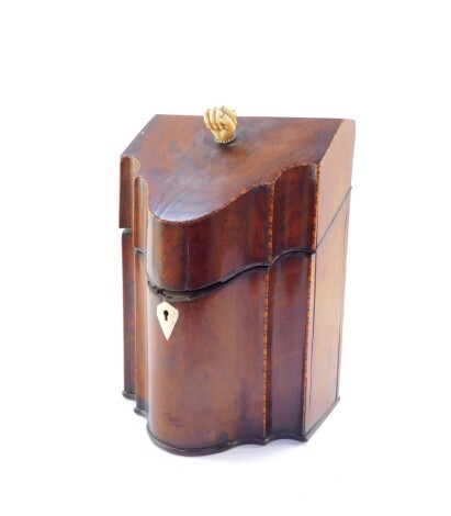 A George III mahogany and box wood strung serpentine knife box, with ivory fist handle, and plain interior, with diamond escutcheon, 32cm high, 23cm wide, 20cm deep.