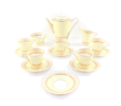A Royal Albert Art Deco porcelain part coffee service, decorated with yellow, apricot and gilt bands, printed marks, comprising coffee pot, cream jug, sugar bowl, five cups and six saucers.