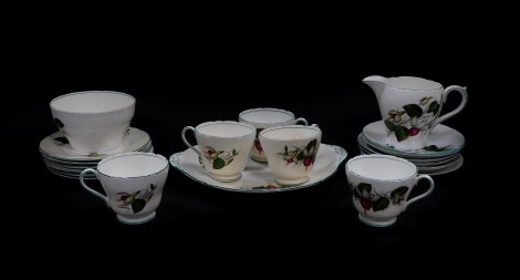 A Shelley porcelain part tea service decorated in the Fuchsia pattern, No 82395, printed and painted marks, comprising bread plate, cream jug, sugar bowl, five tea cups, six saucers and plates.