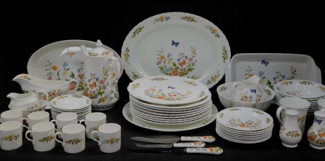 An Aynsley porcelain part dinner and coffee service decorated in the Cottage Garden pattern, comprising; oval meat platter, oval and rectangular serving dishes, gravy boat on stand, salt and pepper, eight dinner plates, fruit bowls and side plates, bread 