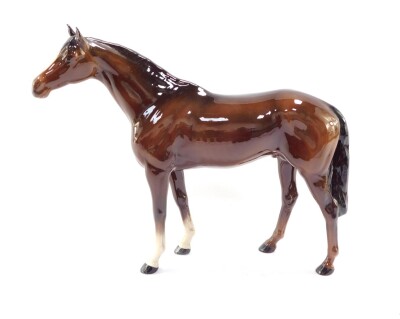 A Beswick figure of a brown gloss horse, printed mark, 35.5cm wide.