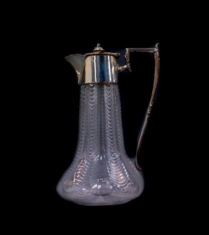 A Victorian cut glass claret jug, possibly Stourbridge, with plated mount and hinged lid, the body with feathered decoration, 23.5cm high.