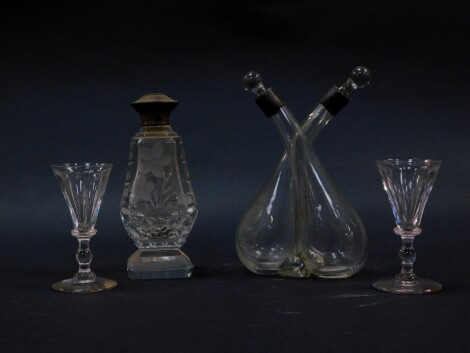 A cut glass conjoined oil and vinegar jar, with silver mounts and glass stoppers, London 1924., a cut glass atomiser, engraved with flowers, with silver mount, puffer lacking, and a pair of Victorian cut glass cordial glasses. (4)