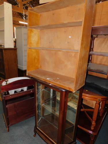 A plywood bookcase, 90cm high, 77cm wide, 26cm deep, together with a mahogany effect china cabinet, 108cm high, 76cm wide, 31cm deep. (2)