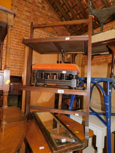 An oak folding stand, together with a Victorian gout stool and a mirror. (3)