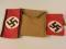 Two swastika arm bands and canvas pouch