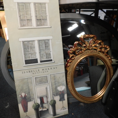 A gilt wood finish mirror with an elaborate finial, 45cm high, oval mirror, etc., (a quantity).