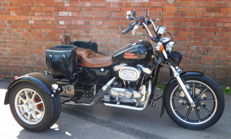 A Harley-Davidson trike, D405 UGF, a 1989 first registered 1987 manufacture machine, 1100cc petrol engined 3-wheeler, currently SORN and with an MOT expired on 2nd January 2021 and an odometer reading showing of 3,240 miles. To be sold upon instructions f