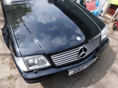 A Mercedes SL320 convertible, DBZ 732, first registered 23rd October 2000, 3199cc dual fuel LPG conversion installed in 2008, automatic, currently SORN with an MOT expiry of 21st September 2021, 66,557 recorded miles. To be sold upon instruction from the - 14