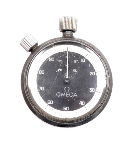 An Omega steel cased stop watch, the black dial with white outer border, inscribed to back E M G A S 54, 5cm diameter.