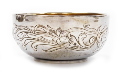 An Edwardian Art Nouveau silver bowl, with repoussé decoration of flowers and leaves, Chester 1905, 12cm diameter, 4.2oz.