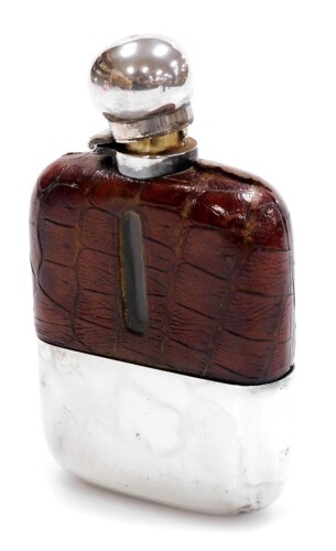 A George V silver and moc crocodile skin bound hip flask, with bayonet cap and glass lining, removable cup base, Sheffield 1915, 14cm high, 11oz all in.