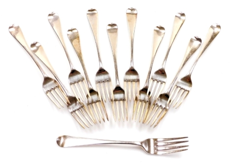 A set of twelve George III Old English pattern silver table forks, London 1802 (8), and 1804 (4), 21.5oz. (12)