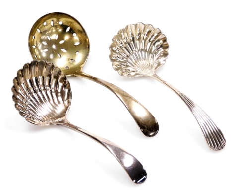 A George V Old English pattern silver sugar sifter spoon, with pierced bowl, Birmingham 1928, and two silver plated sifting spoons, (3).