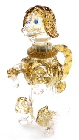 A ballooned glass dog decanter, the twist and reeded stem handle, with a dog stopper top (AF), 21cm high.