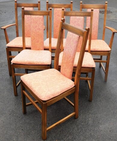 A set of eight light elm Ercol dining chairs, in a light beech and elm with pink floral decoration.