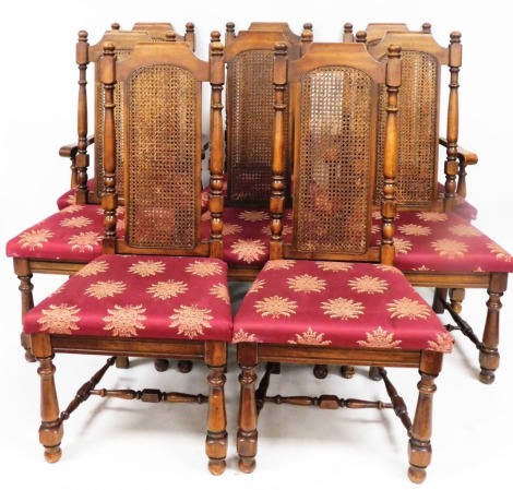 A set of eight walnut rush back throne type dining chairs, each with central rectangular rush panel, on turned supports, with red and gilt upholstered seats, comprising two carvers and six chairs, 116cm high, 55cm wide, 50cm deep.