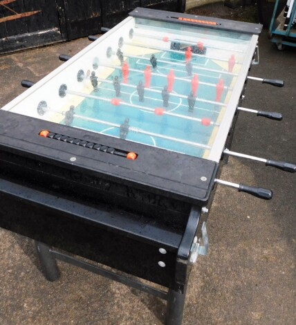 A FAS table football machine, with balls, base, and brackets, 97cm high, 170cm deep, 117cm wide. Note: VAT is payable on the hammer price of this lot at 20%.