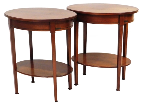 A pair of Grange Furniture oval occasional tables, each on square tapering legs joined by an oval under tier, 65cm high, 58cm wide, 40cm deep. (2)