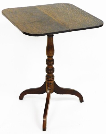 A late 19thC carved oak tripod table, the rectangular top with canted corners, on drop leaf top with tripod base, 55cm wide, 70cm high, 55cm deep.