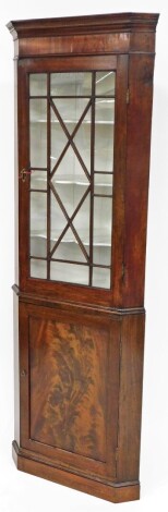 A late 19thC flame mahogany corner cabinet, the top with single astragal glazed doors, cupboard base, with cornice pediment, 195cm high, 60cm wide, 35cm deep.